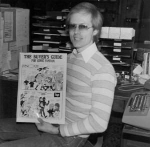 Alan Light holds Terry Beatty's cover art for the final issue of The Buyer's Guide to Comic Fandom.